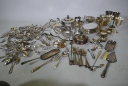 A quantity of silver plate to include a three piece tea set, serving tureens, goblets, etc, and a
