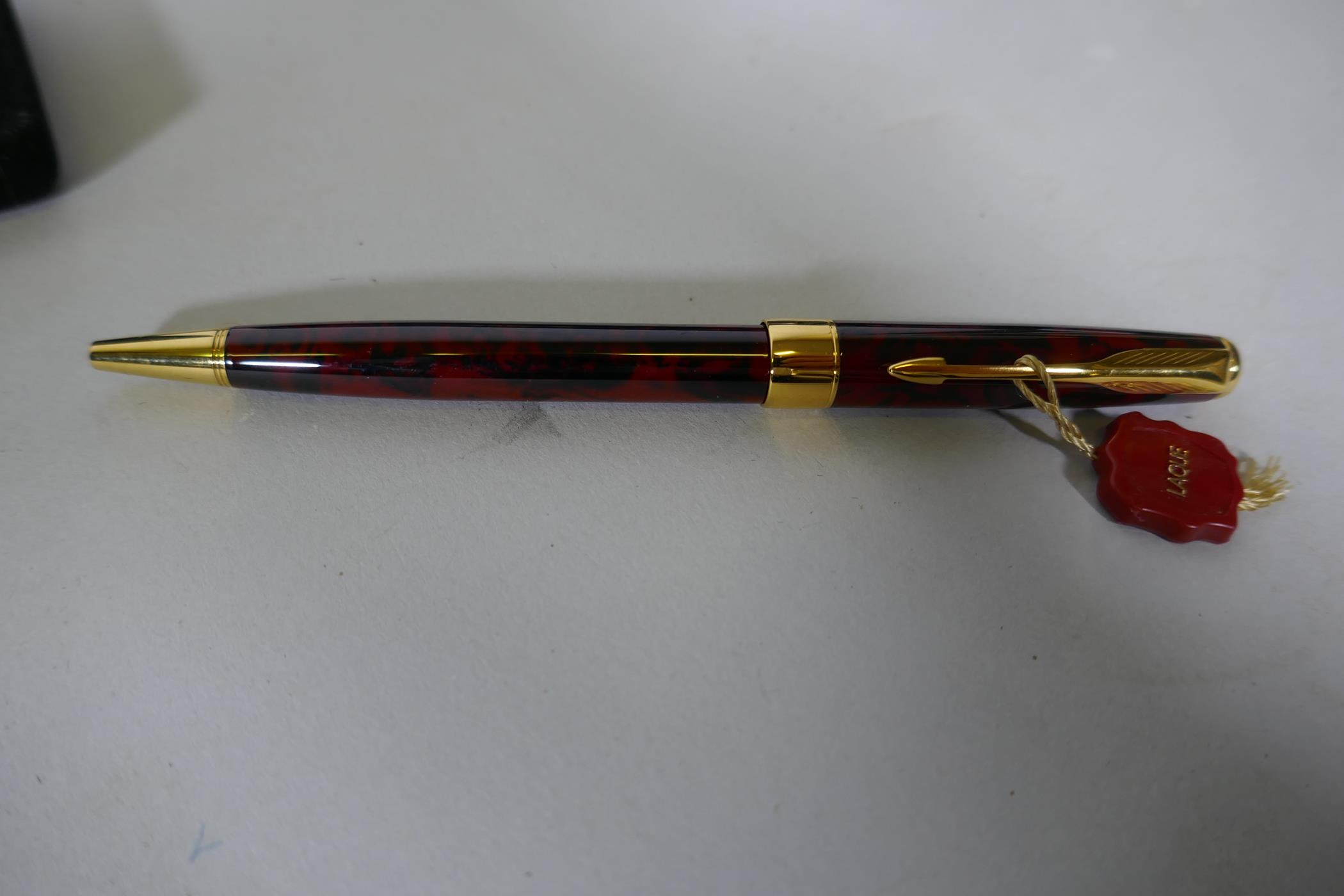 A Watermans gold plated fountain pen with 18ct nib in box, appears unused, and a Parker Sonnet - Image 3 of 3