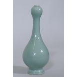 A Chinese garlic head vase with celadon glaze, seal mark to base, 18cm high