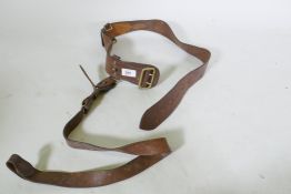A British Army Officer's brown leather belt, stamped B M & G Ltd, 1956
