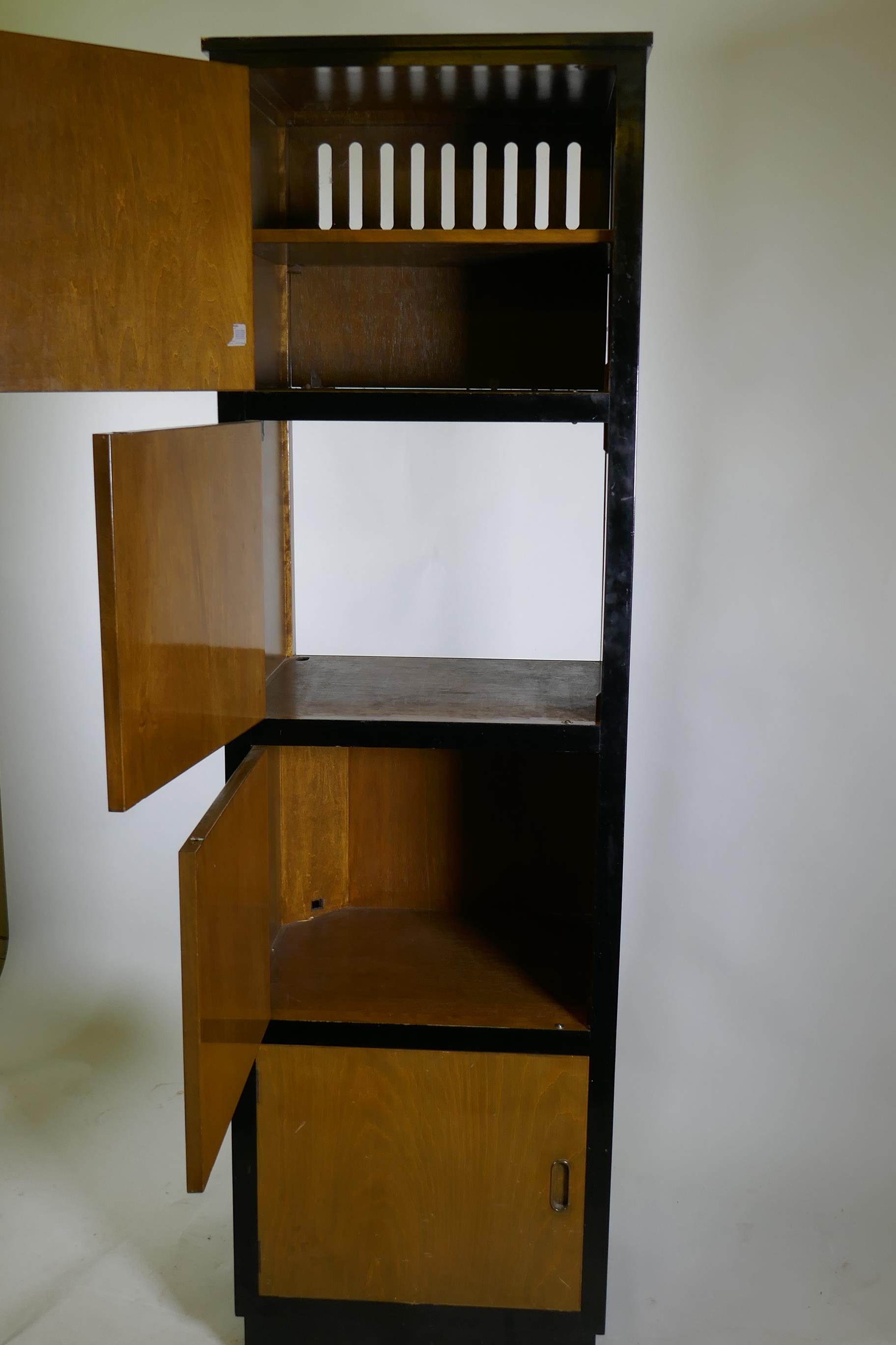 A bespoke mid-century cherry wood and black lacquer media cabinet of four cupboards, 56 x 49 x 193cm - Image 2 of 3