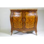 A C19th French marquetry inlaid bombe shaped two door cabinet with breccia marble top and ormolu