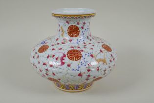 A Chinese polychrome porcelain vase of squat form, decorated with peaches, bats and auspicious