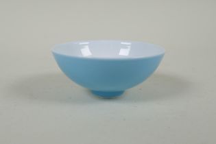 A Chinese powder blue glazed porcelain tea bowl, GuangXu 6 character mark to base, 8cm diameter