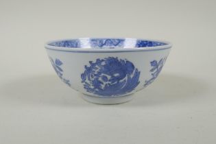 A Chinese blue and white porcelain bowl with phoenix and floral decoration, Qianlong 6 character