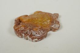 A Chinese carved and pierced hardstone pendant in the form of a dragon turtle, 9cm long