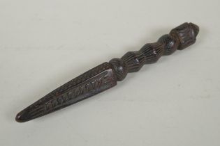 An antique Tibetan ceremonial carved hardwood phurba, 23cm