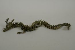 A Japanese Jizai style bronze okimono dragon with articulated body and limbs, 42cm long