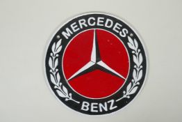 A 'Mercedes Benz' painted cast iron wall plaque, 24cm diameter