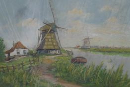 Dutch School, canal scene with windmills, signed, mid C20th, oil on canvas, 70 x 50cm
