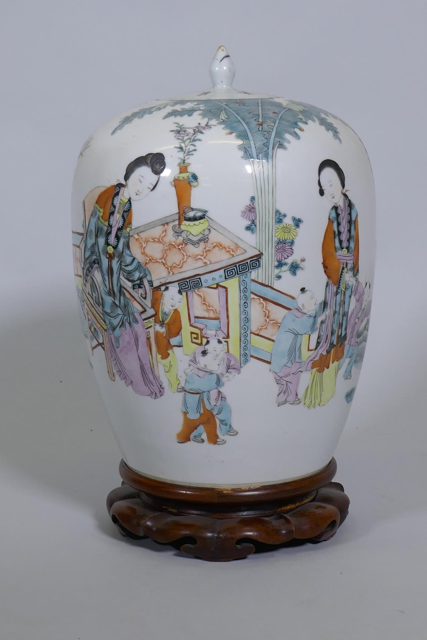 A Chinese famille verte jar and cover, decorated with women and five boys in a garden, with