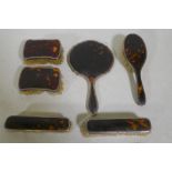A matched tortoiseshell and silver mounted dressing table set, c1920