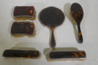 A matched tortoiseshell and silver mounted dressing table set, c1920