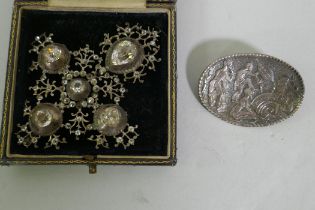 A Candida South African silver brooch decorated with warriors dancing, 53mm long, and a vintage