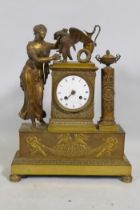 A C19th French Empire style ormolu mantel clock, with classical draped figure and orament, the