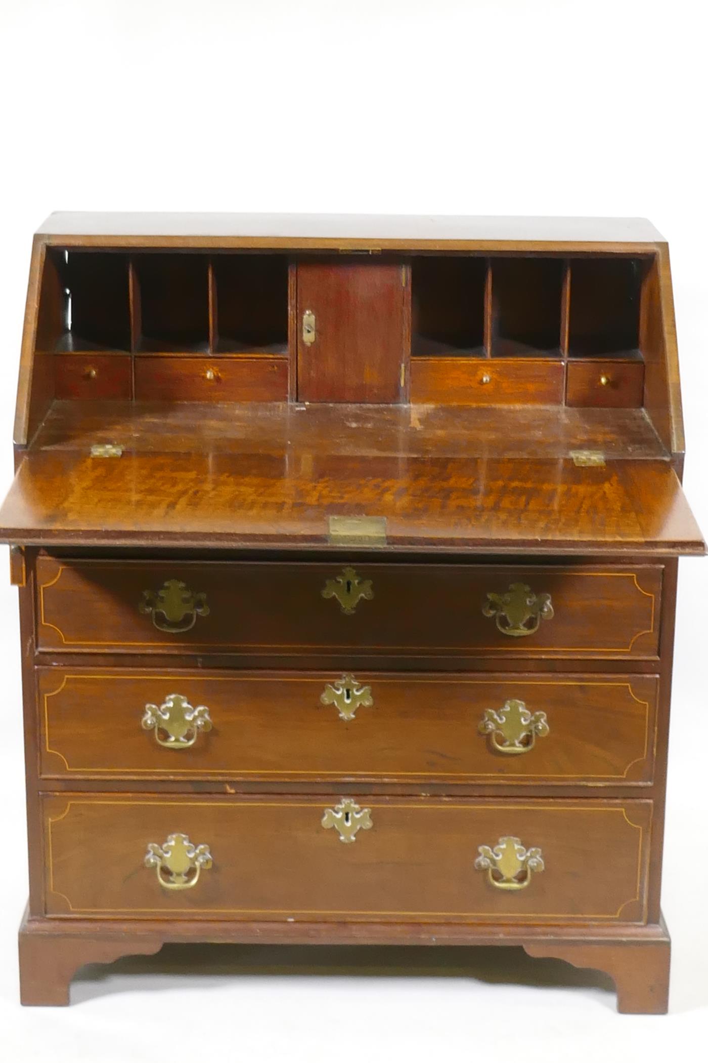 A Georgian inlaid mahogany bureau of small proportions, the fall front with fitted interior over - Image 2 of 3