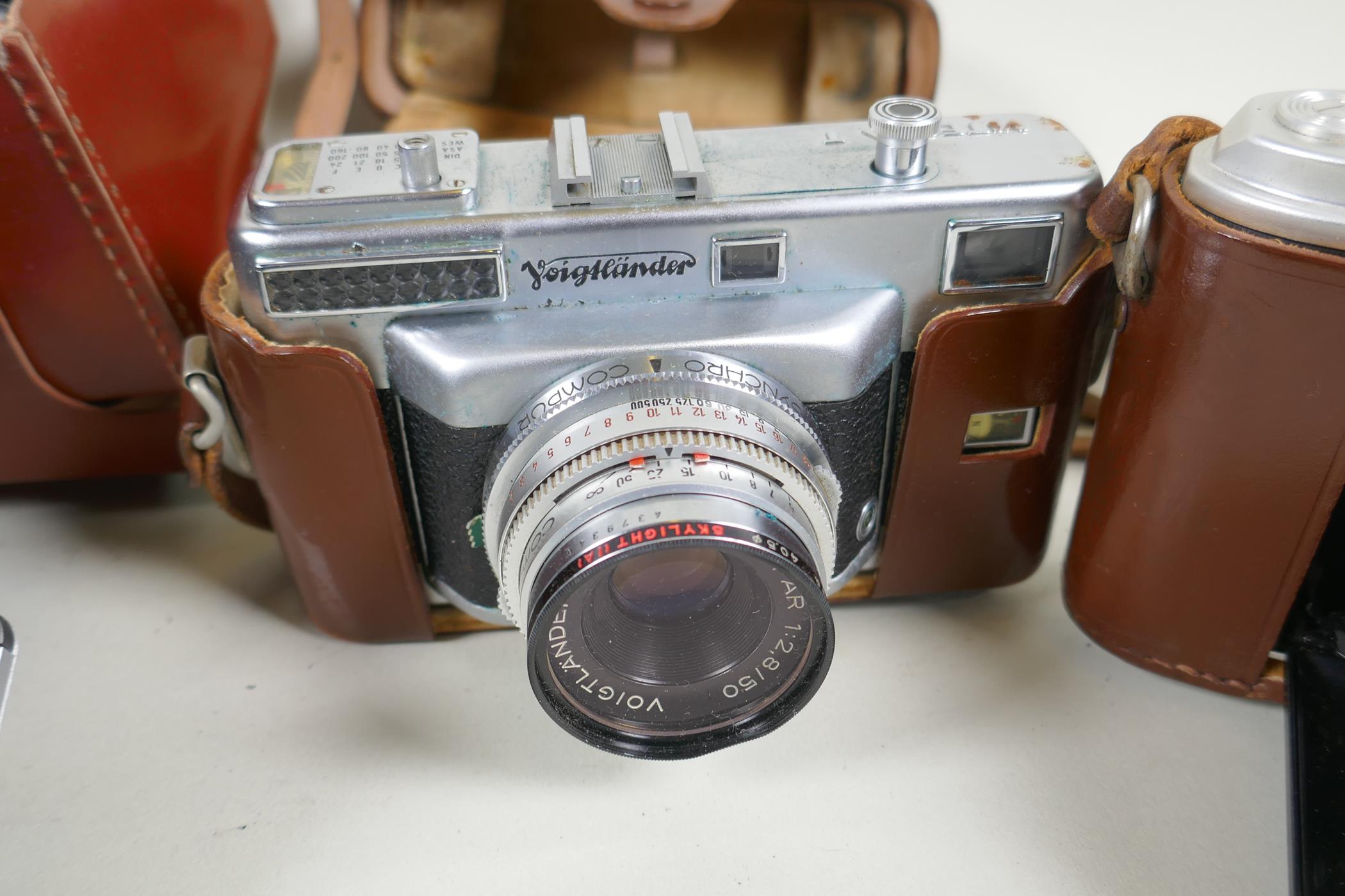 A quantity of vintage 35mm and medium format cameras and accessories, to include a Canon AV-1, a - Image 4 of 8