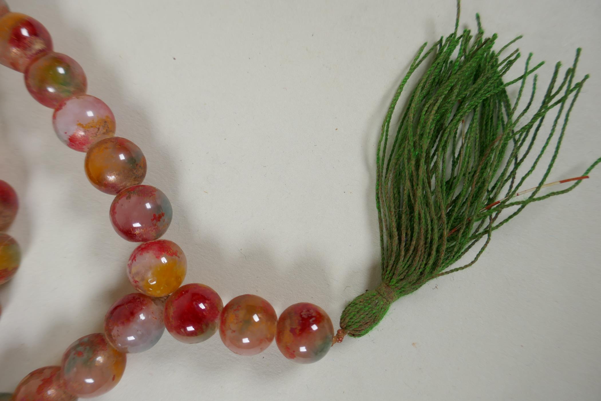 A string of multicolour hardstone/jade mala beads with the remnants of gilt lustre, 122cm long - Image 6 of 6