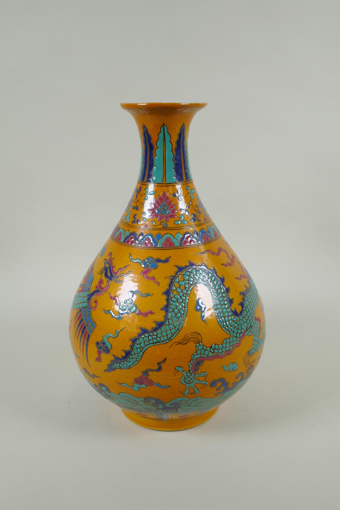 A Chinese yellow ground porcelain pear shaped vase with enamel decoration of a dragon and phoenix, - Image 4 of 6