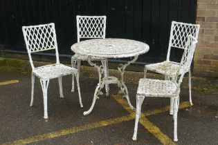 A painted metal garden table and four chairs with faux bamboo decoration and trellis backs, 80cm