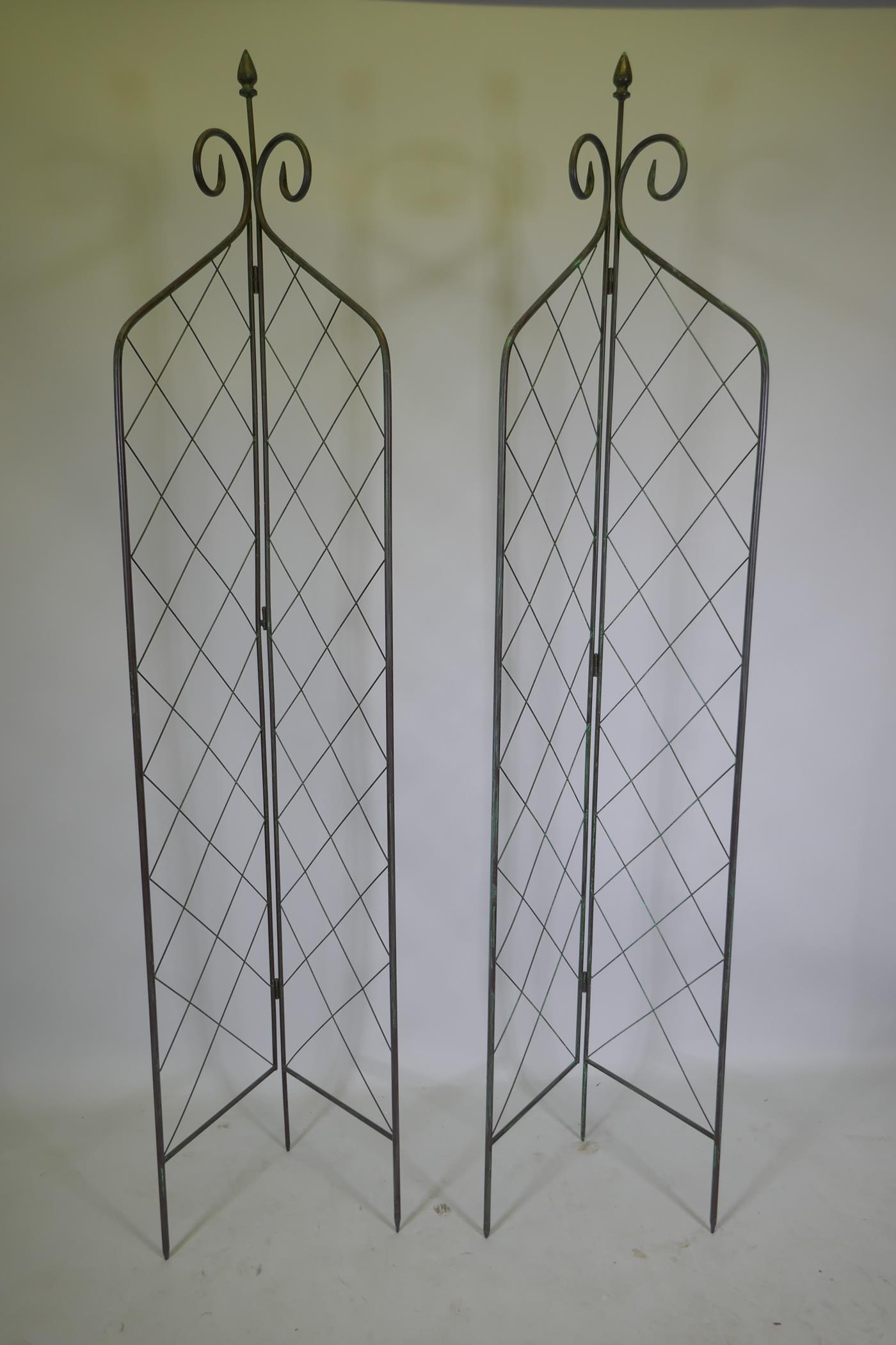 A pair of bifold metal plant supports, 210cm high