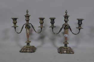 A pair of Sheffield silver plated two branch candelabra, 40cm high