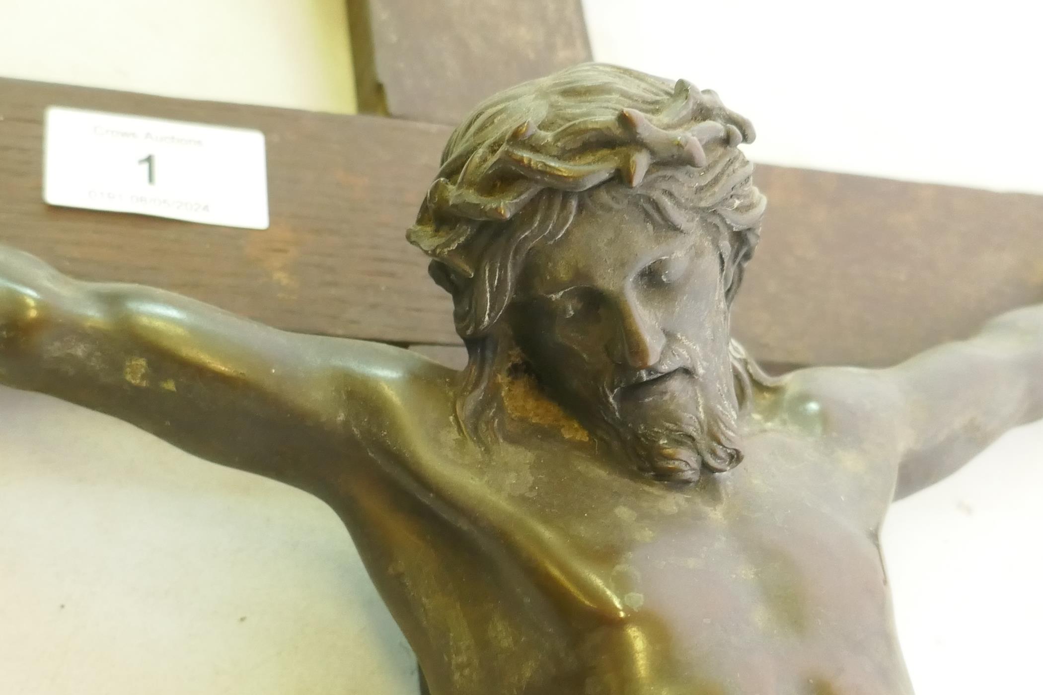 A C19th Continental bronze Corpus Christi, mounted on an oak crucifix with tablet, marked AA, - Image 3 of 6