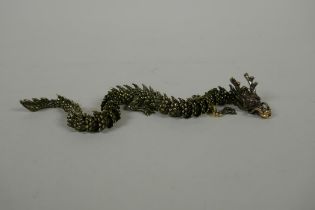 A Japanese Jizai style articulated bronze okimono dragon, 22cm long