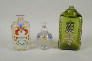 Two C18th/C19th enamelled Stiegel type glass bottles and a similar type perfume bottle, largest 18cm