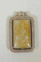 A Chinese white metal pendant with revolving jade panel with Buddha decoration, 6cm
