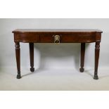 A Georgian mahogany breakfront serving table with panelled frieze and single drawer, raised on