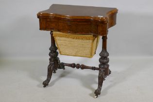 A Victorian serpentine shaped burr walut work box/games table, the top opening to reveal a chequer