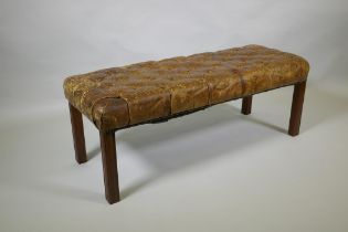 A Victorian leather Chesterfield bench, 110 x 40cm, 42cm high