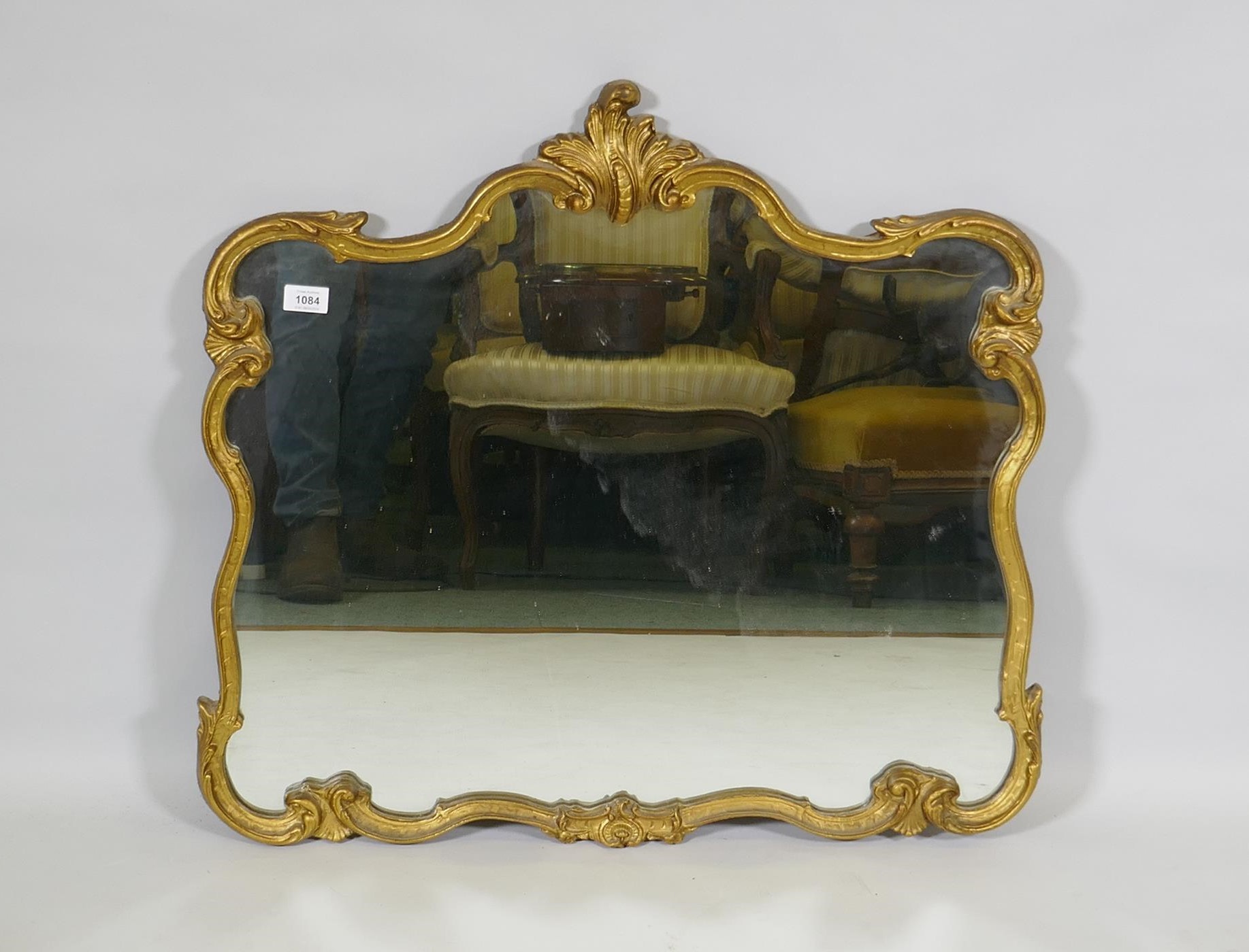 A vintage giltwood and composition rococo style wall mirror, 76 x 72cm