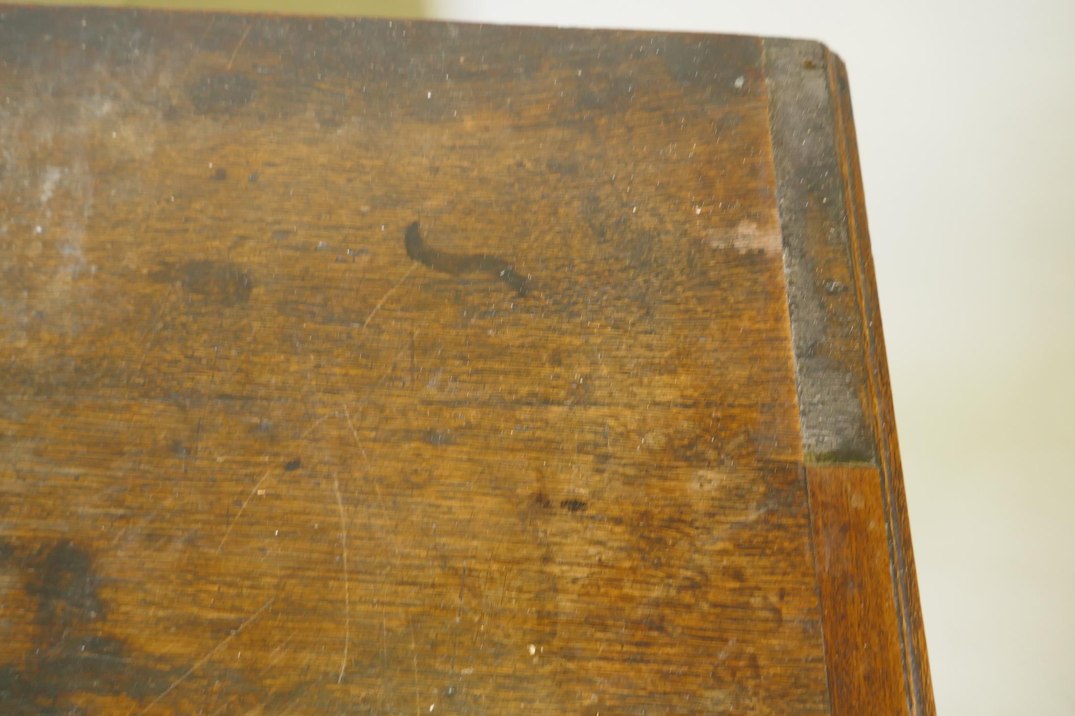 A Georgian oak chest of two over three drawers, mahogany banded top, cockbeaded drawers with - Image 5 of 7