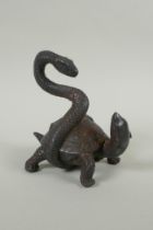 A Chinese filled bronze figure of a tortoise entwined with a snake, with the remnants of gilt
