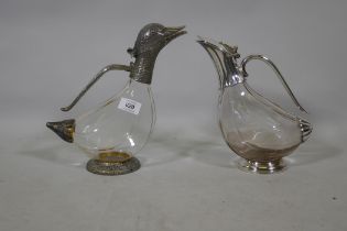 A glass decanter with silver plated mounts in the form of a duck 27cm high, and another similar