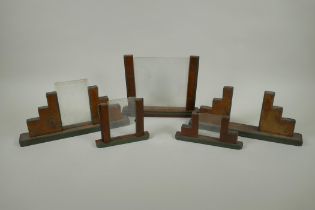 Five early C20th Art Deco walnut photograph frames, largest 26cm wide, 20cm high