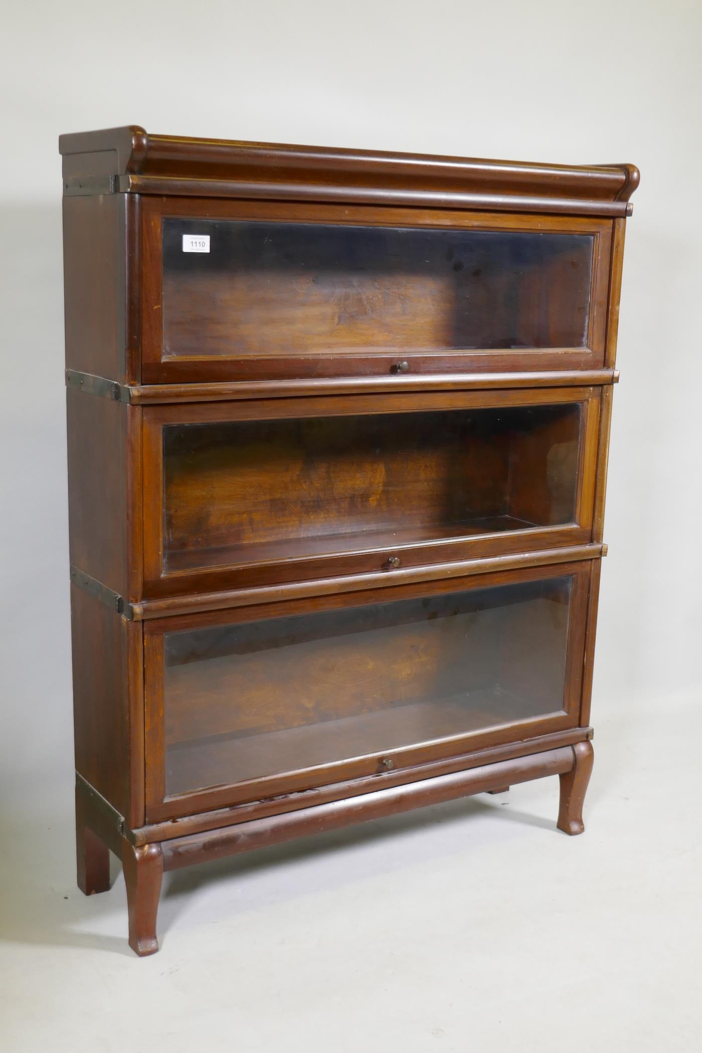 A mahogany Globe Wernicke style three section bookcase, raised on a base with shaped supports, 87 - Image 2 of 2