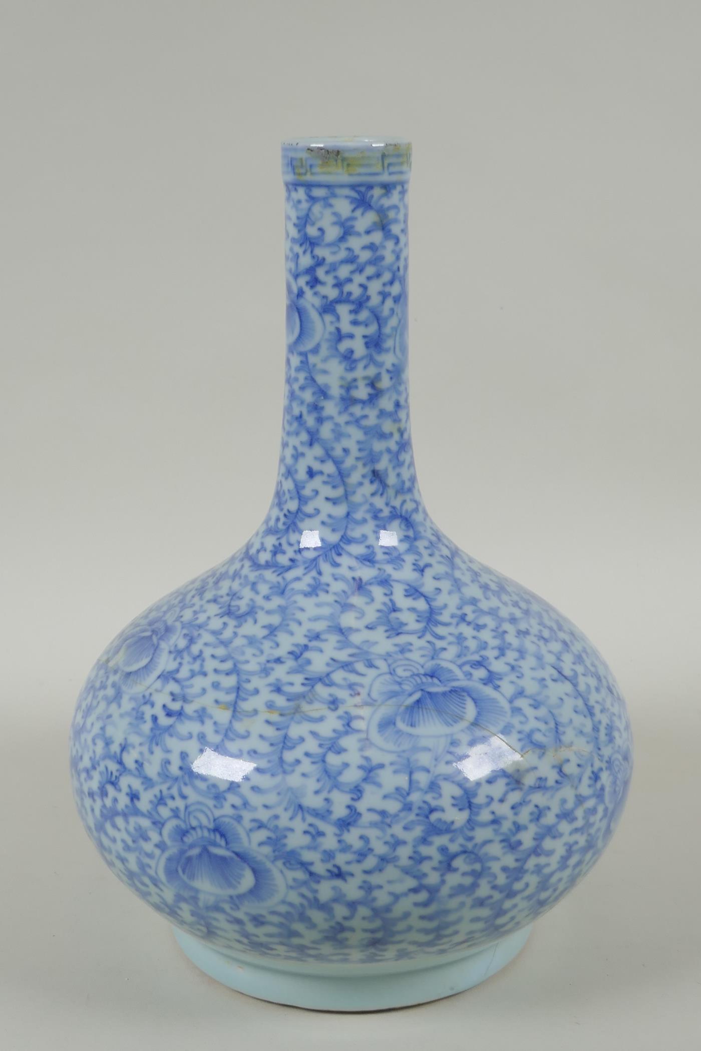 A C19th Chinese blue and white porcelain bottle vase with scrolling floral decoration, AF repair, - Image 3 of 6