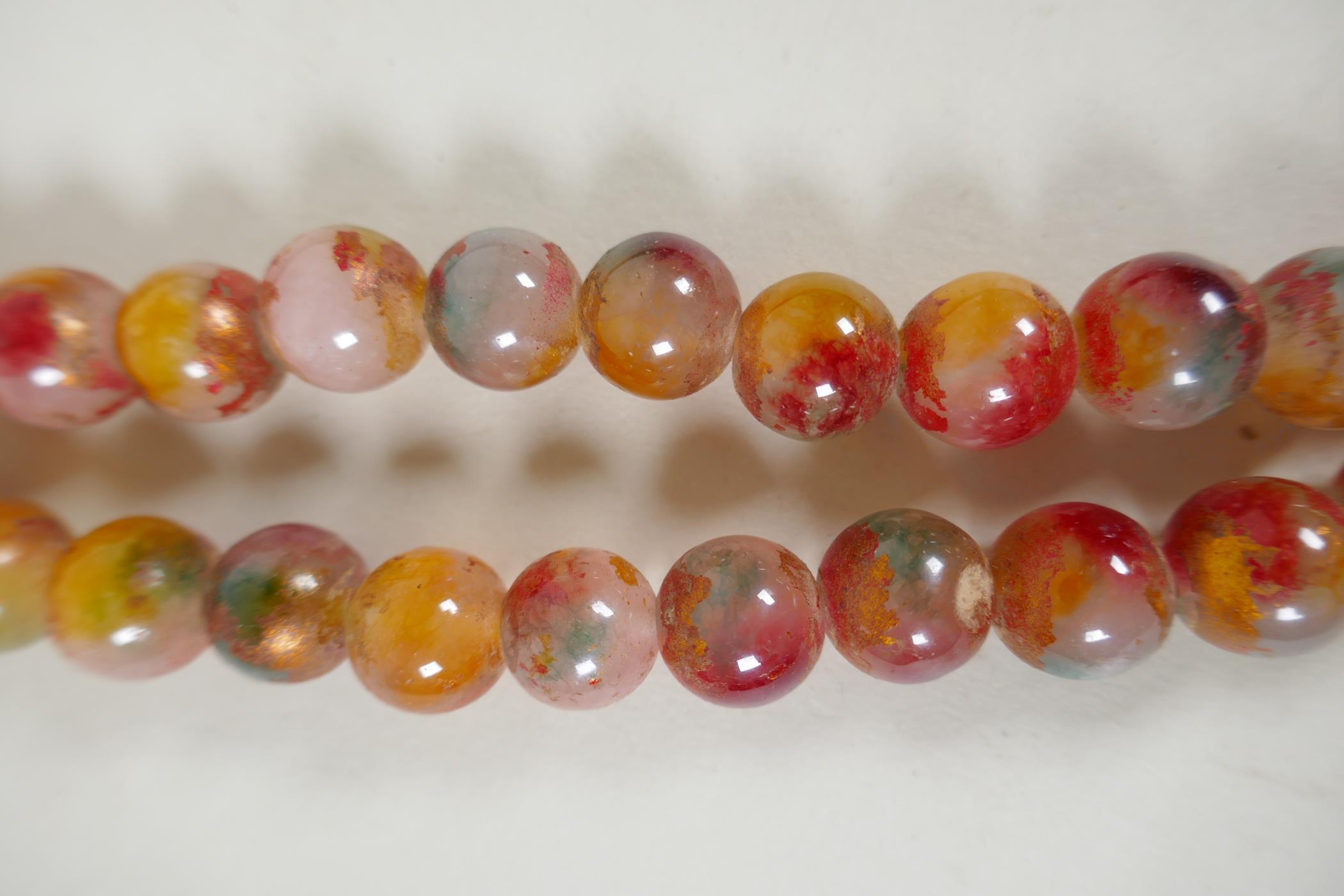 A string of multicolour hardstone/jade mala beads with the remnants of gilt lustre, 122cm long - Image 3 of 6