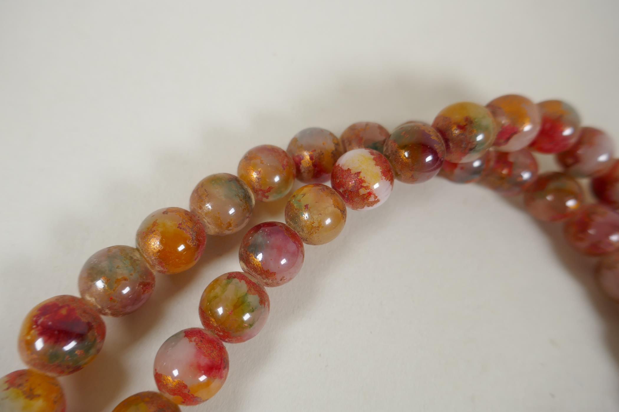 A string of multicolour hardstone/jade mala beads with the remnants of gilt lustre, 122cm long - Image 4 of 6