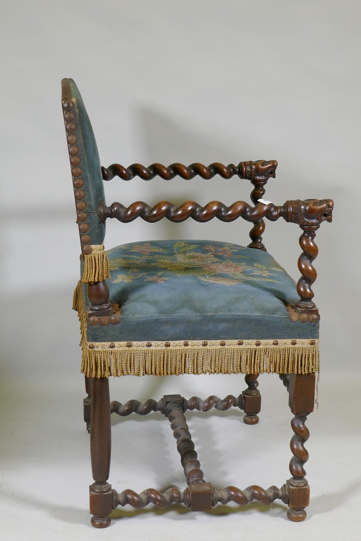 A Jacobean style walnut open armchair with barley twist and carved lion decoration, studded tapestry - Image 3 of 3