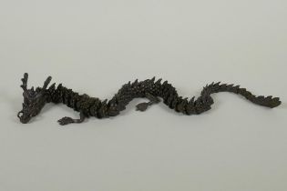 A Japanese Jizai style bronze okimono dragon, 40cm long