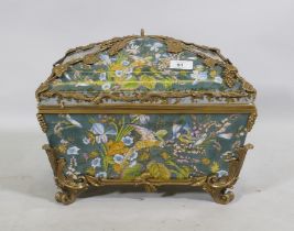 A porcelain casket decorated with exotic birds and brass mounts with grape and vine detail, 37 x