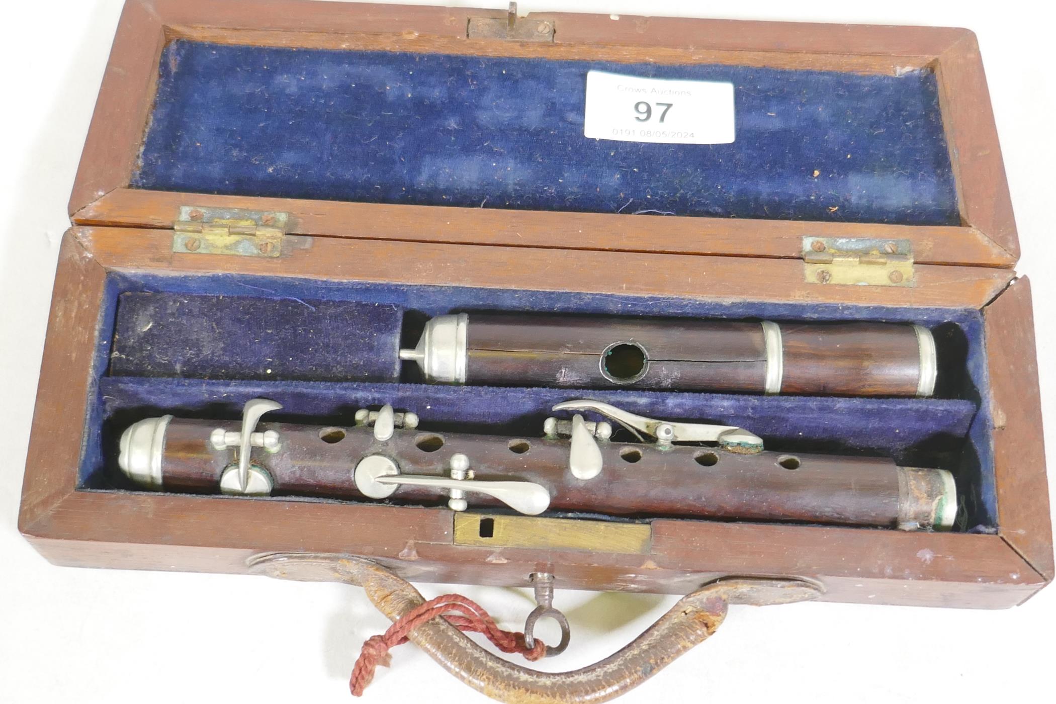 A piccolo in wood case,AF, 30cm long