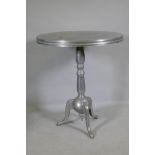 An aluminium pub table on tripod supports, 80cm diameter x 93cm high
