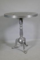 An aluminium pub table on tripod supports, 80cm diameter x 93cm high