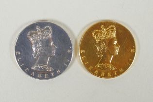 A pair of 9ct gold and silver Elizabeth II commemorative coins, in a fitted box, gold coin 6.5g,