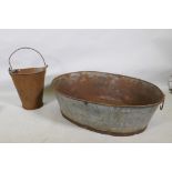 A galvanised metal oval trough and a half gallon hopper, 82 x 62cm